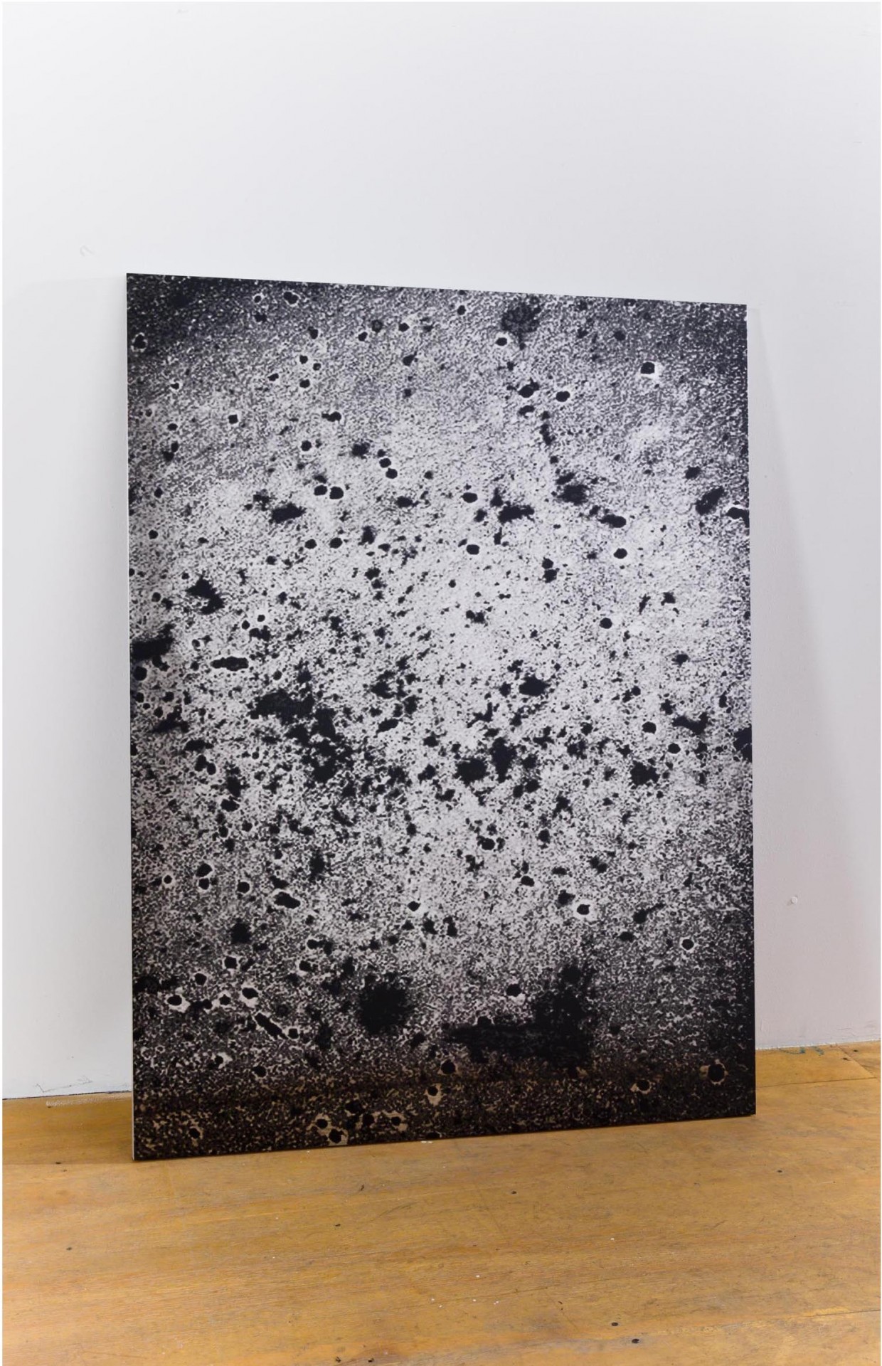 John Jurayj, *Untitled (Abstraction #7)*, 2011. Gunpowder and ink screened on polished stainless steel