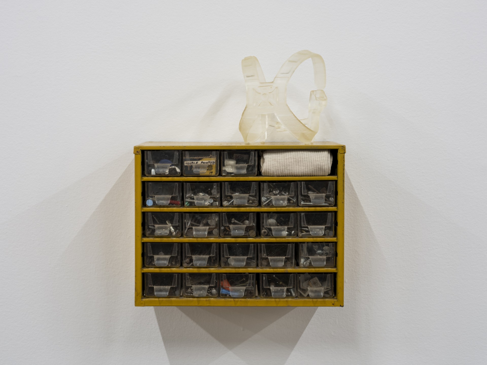 Anna Campbell, *Fasteners*, 2022, 3D resin print, undershirt, hardware storage cabinet. Photo: Daniel Kukla.