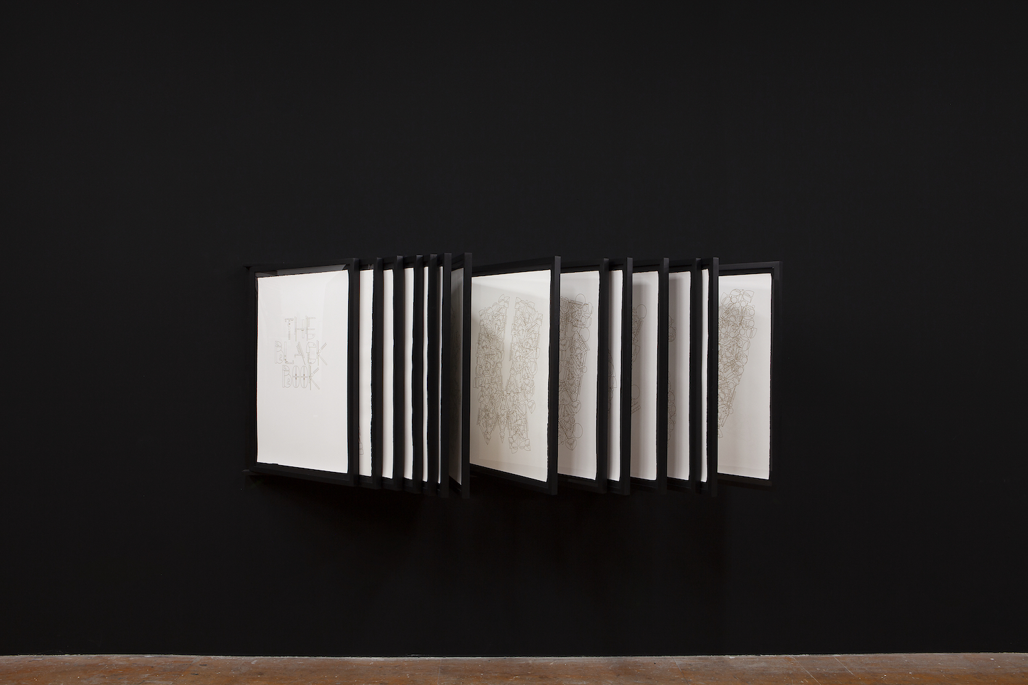 Glendalys Medina, *The Black Book*, 2019, installation view. Marker on 27 sheets of paper. 24 x 36 inches each